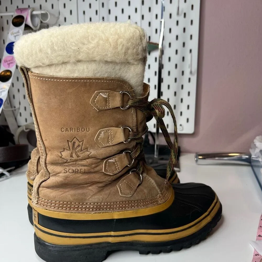 Sorel Caribou waterproof winter boots in tan leather featuring a distinctive cre
